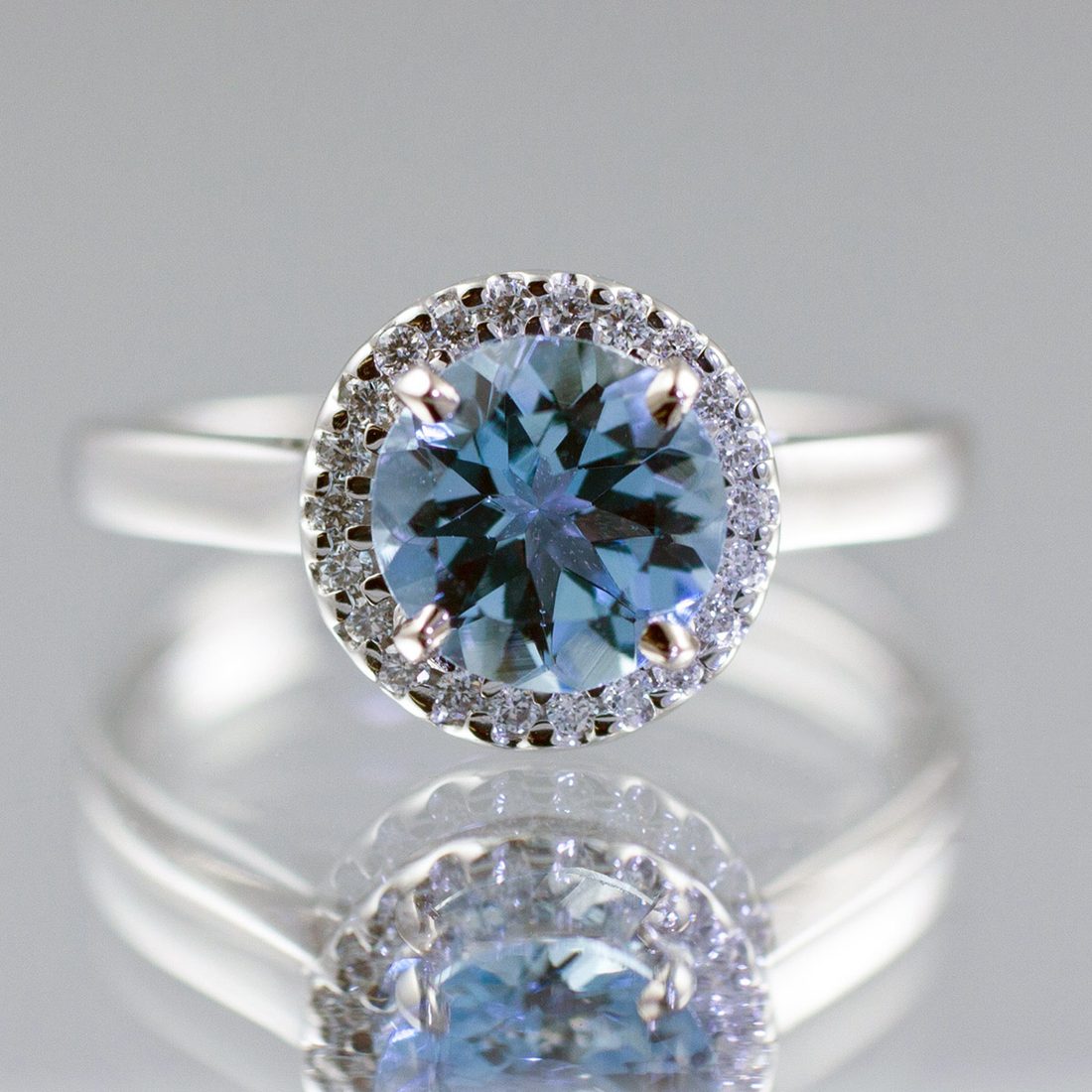 A princess-cut diamond with channel-set shoulders in white gold, made at Nicholson Goldsmiths