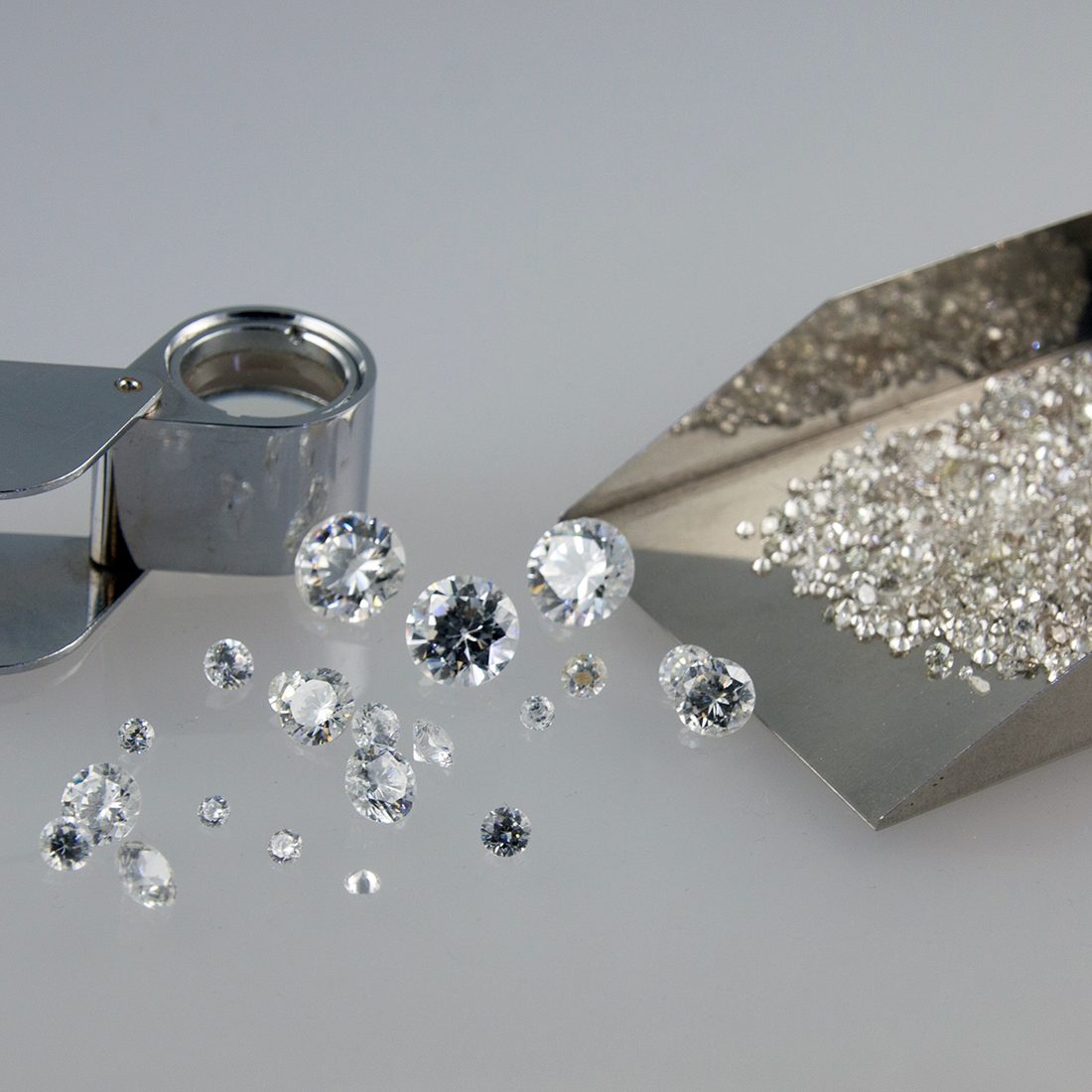 A bespoke diamond ring with channel-set shoulders, finished on the Nicholson Goldsmiths bench