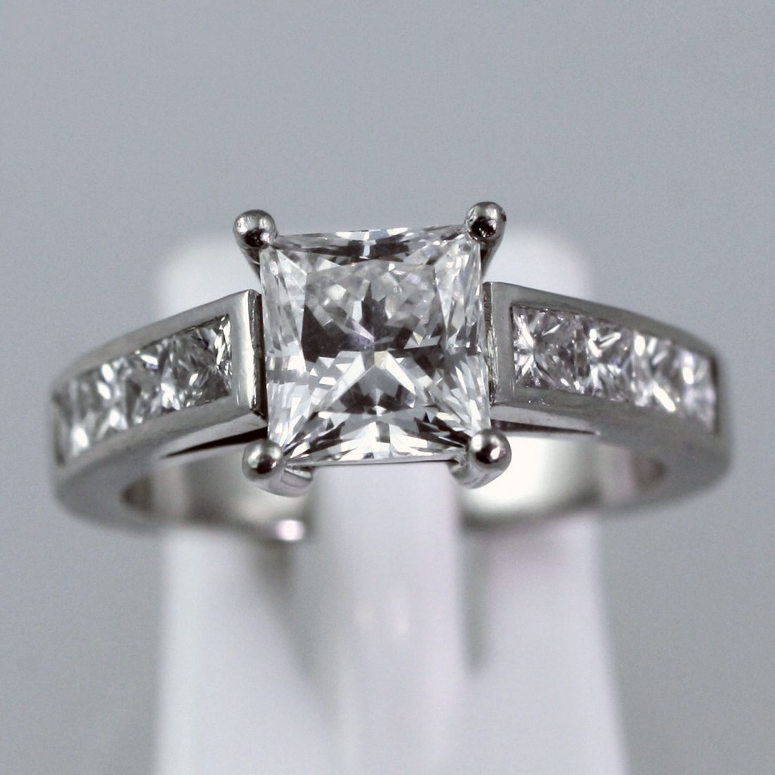 A diamond bracelet, halo cluster ring, princess solitaire, pave-set ring and cluster earrings, recent work on the Nicholson Goldsmiths bench